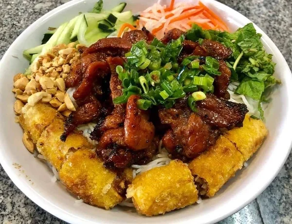 Vermicelli Bowl with Grilled Pork and Egg Rolls